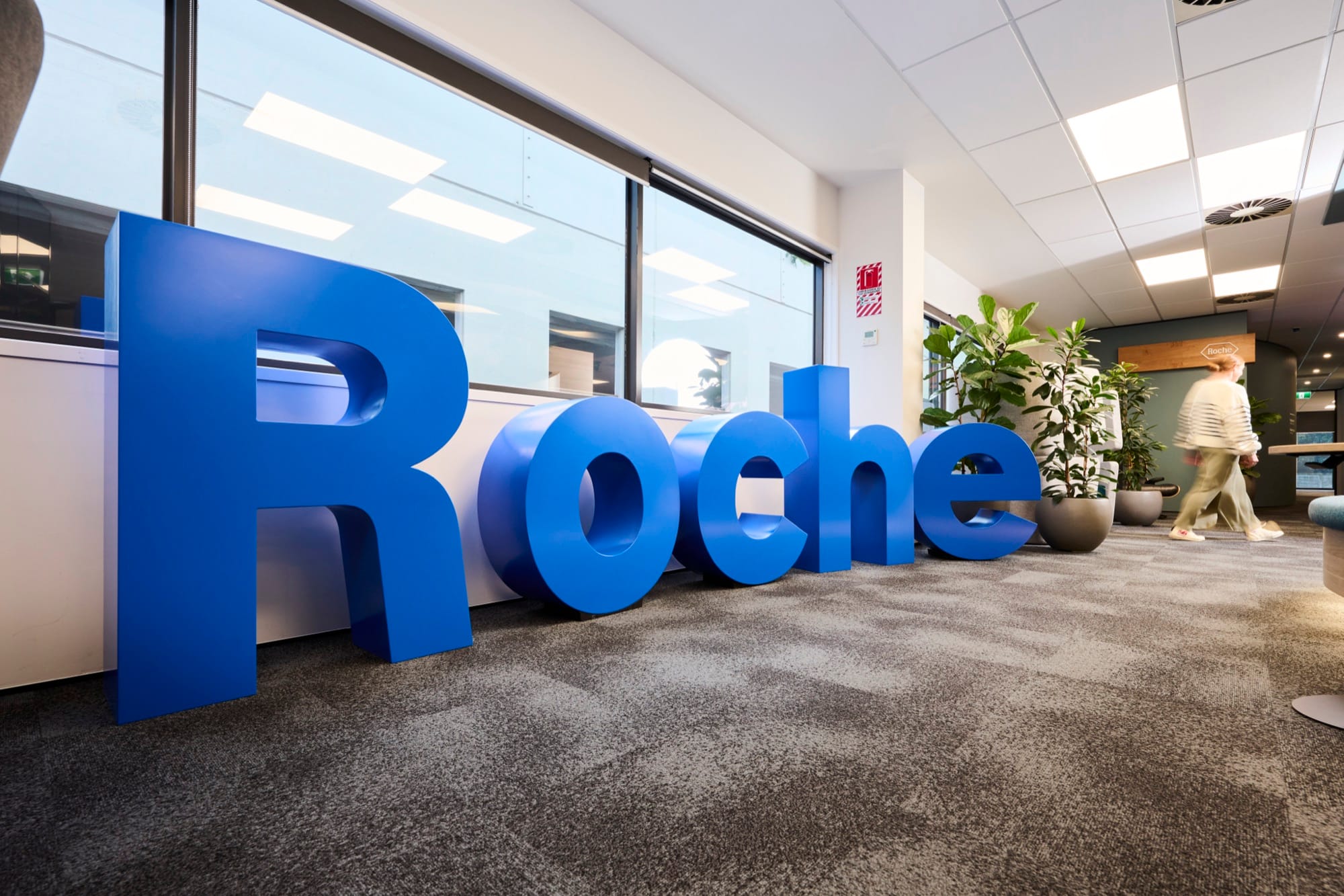 Large blue Roche letters in the open-plan office