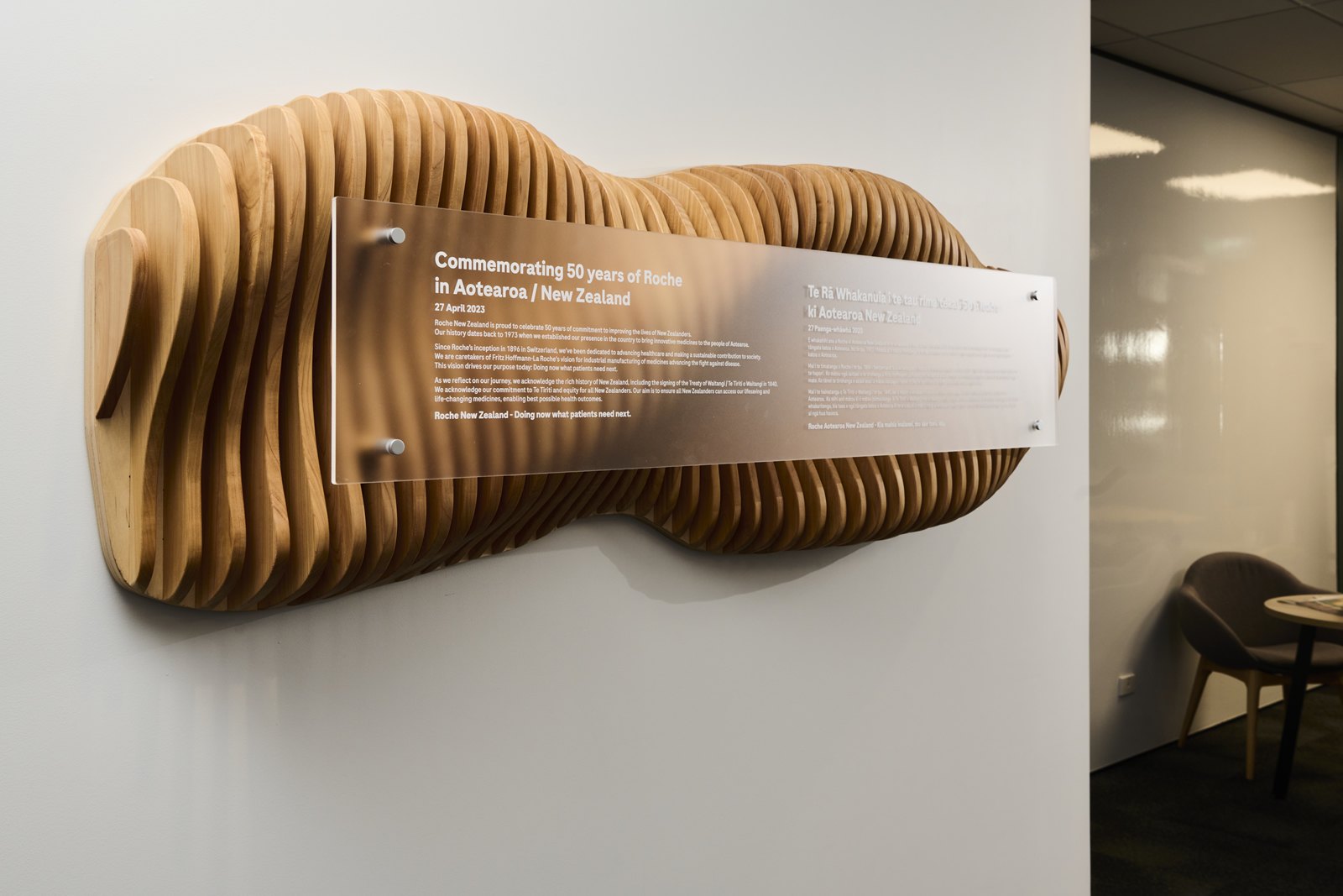 A sculptural timber wall feature in the Roche office