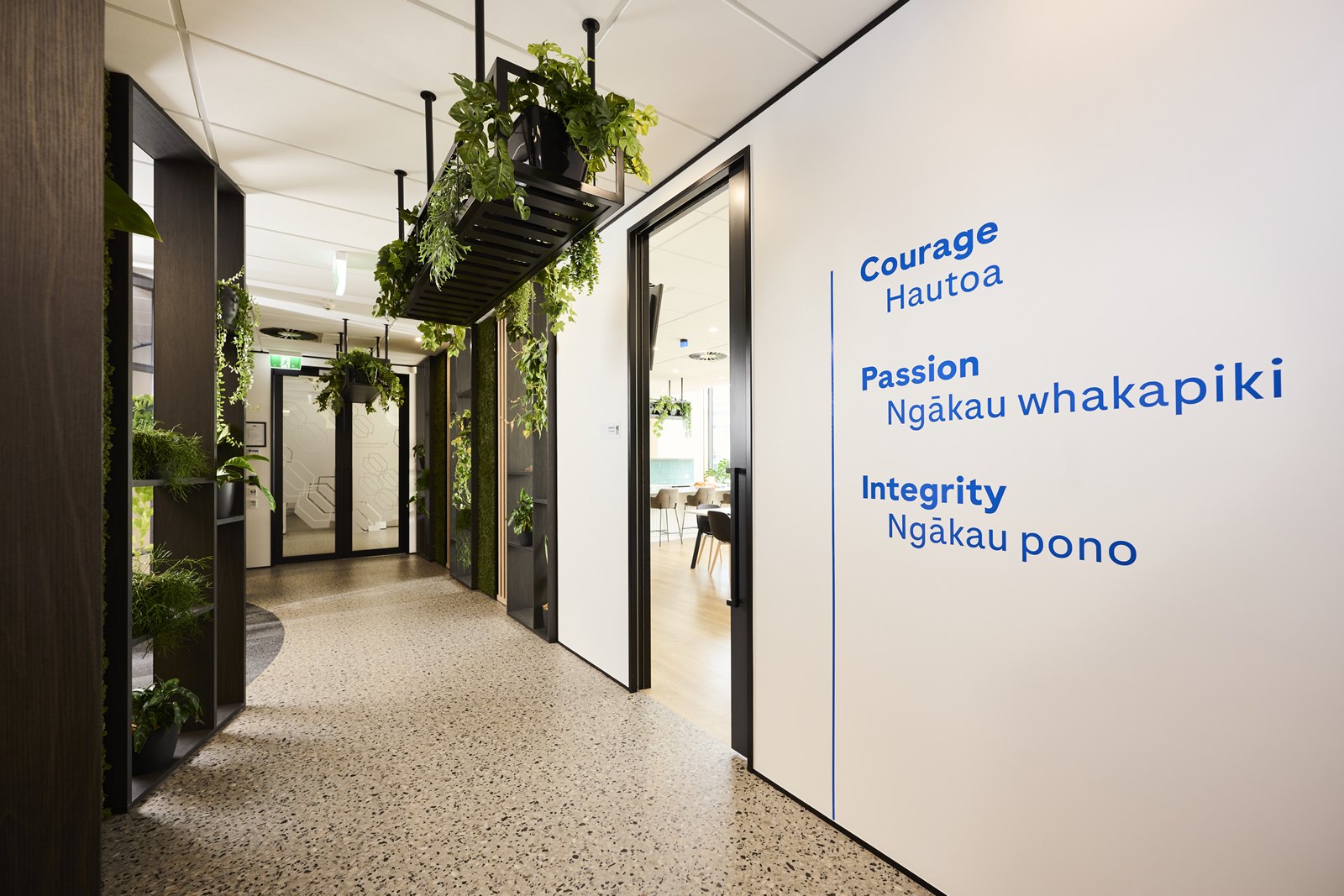 Roche values in English and te reo Māori on a corridor wall